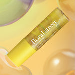Floral Street sunflower pop perfume mist on a yellow background