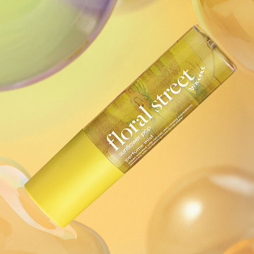 Floral Street sunflower pop perfume mist on a yellow background