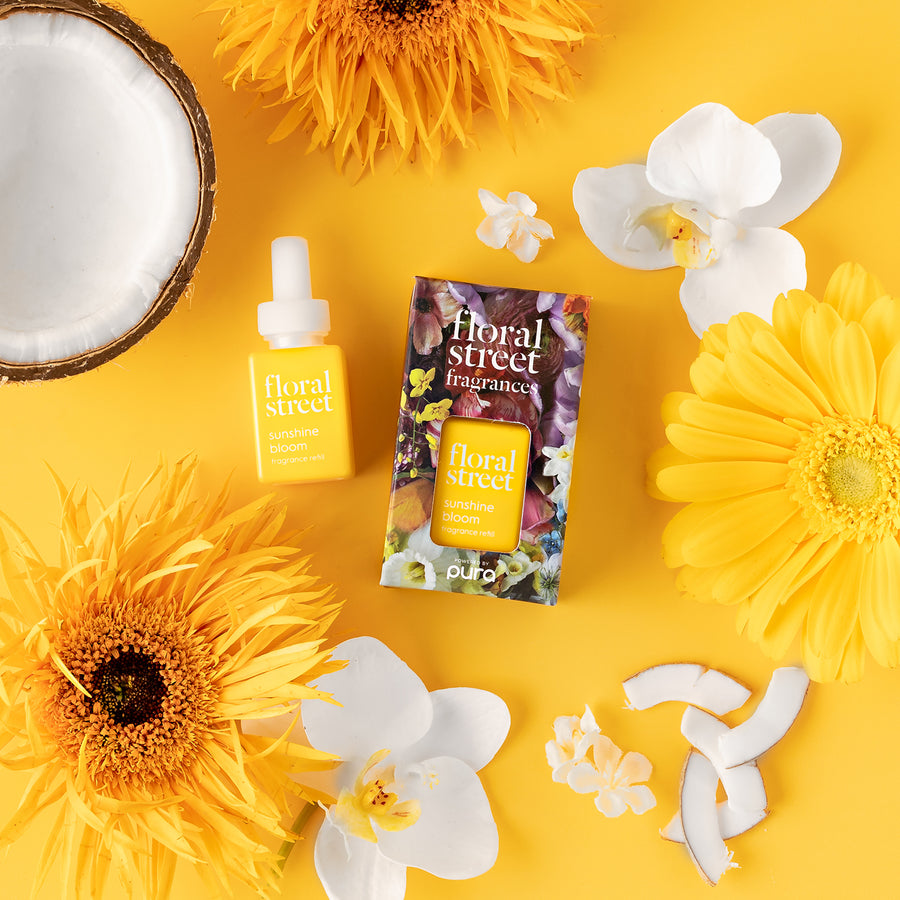 Floral Street x Pura room fragrance refill on a yellow background with flowers