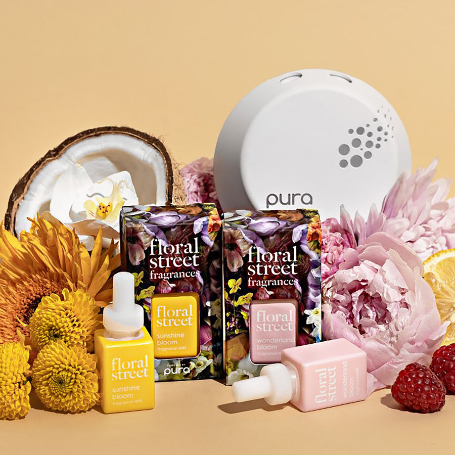 Floral Street and Pura room fragrance refills with flowers and fruits on a beige background.